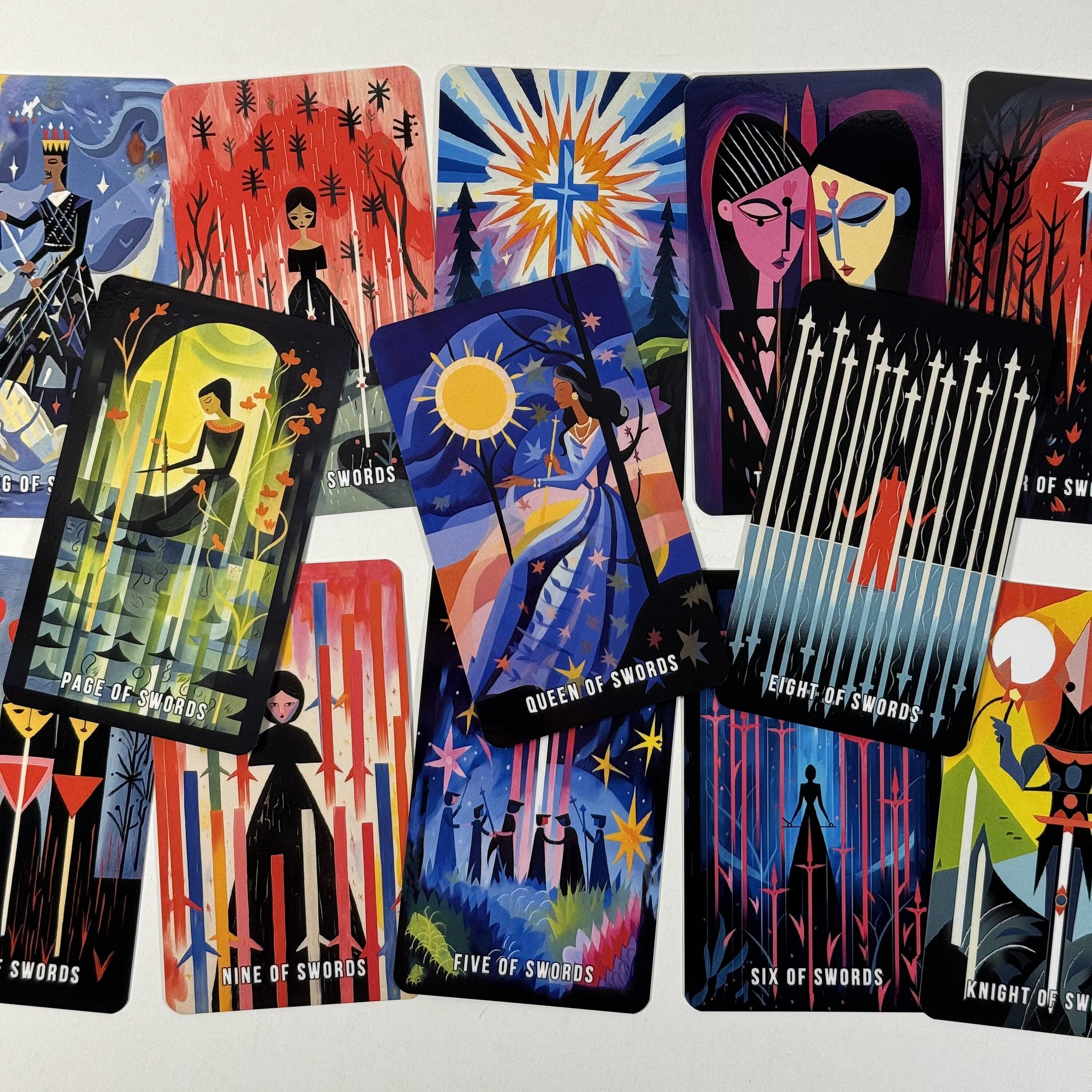 May include: A collection of tarot cards featuring colorful illustrations. The cards display various scenes with figures, celestial bodies, and geometric designs. The cards include text such as "Page of Swords," "Queen of Swords," and "Eight of Swords."